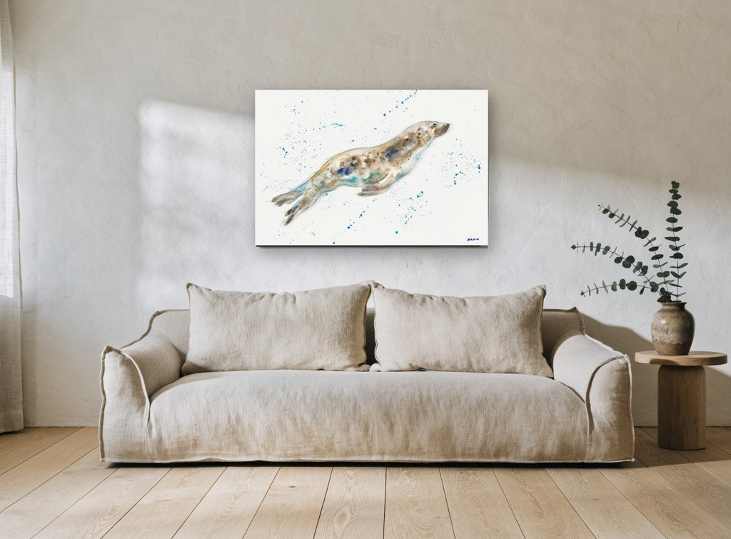 Gliding Seal Splash coastal canvas print on the wall of a living room