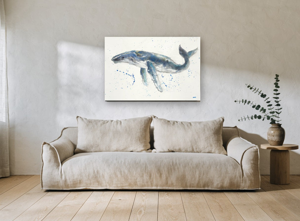 Humpback Drifting Free coastal canvas print on the wall of a living room