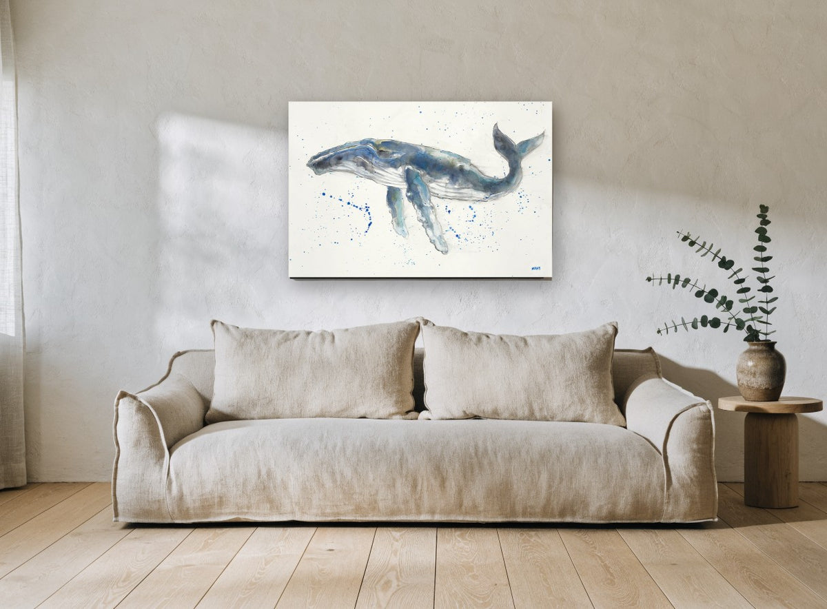 Humpback Drifting Free coastal canvas print on the wall of a living room