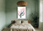 Blushing Coral Branch coastal canvas print on the wall of a bedroom