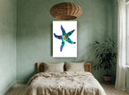 Jewel Tone Starfish coastal canvas print on the wall of a bedroom