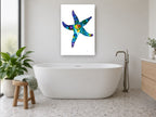 Jewel Tone Starfish coastal canvas print on the wall of a bathroom