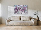 Violet Garden Drift floral canvas print on the wall of a living room