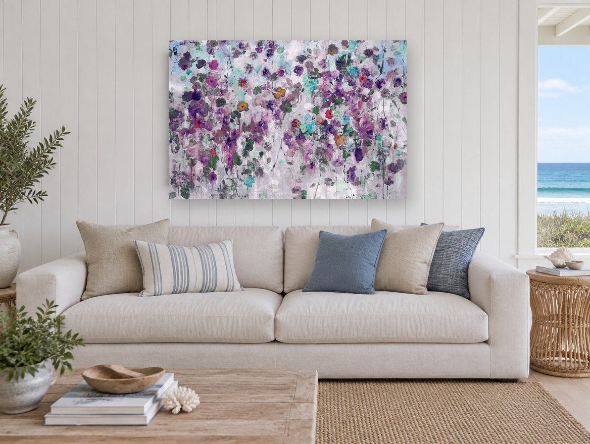 Violet Garden Drift floral canvas print on the wall of a beach house living room
