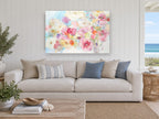 Soft Bloom Haze floral canvas print on the wall of a beach house living room