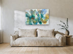 Teal Petal Drift floral canvas print on the wall of a living room