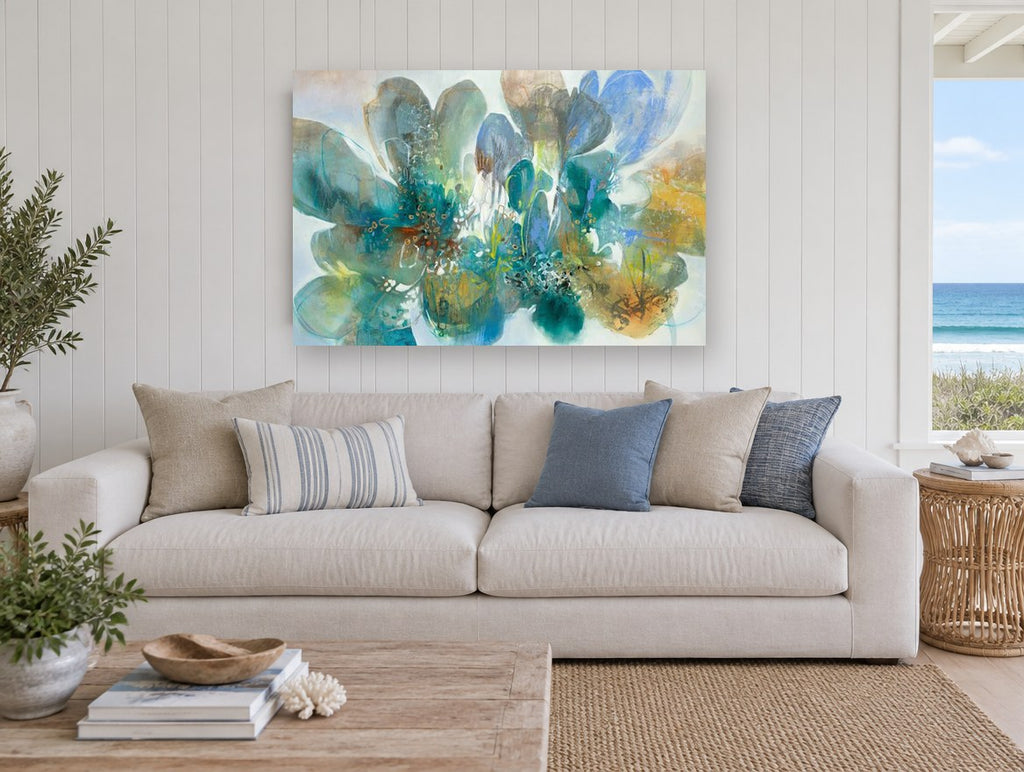 Teal Petal Drift floral canvas print on the wall of a beach house living room