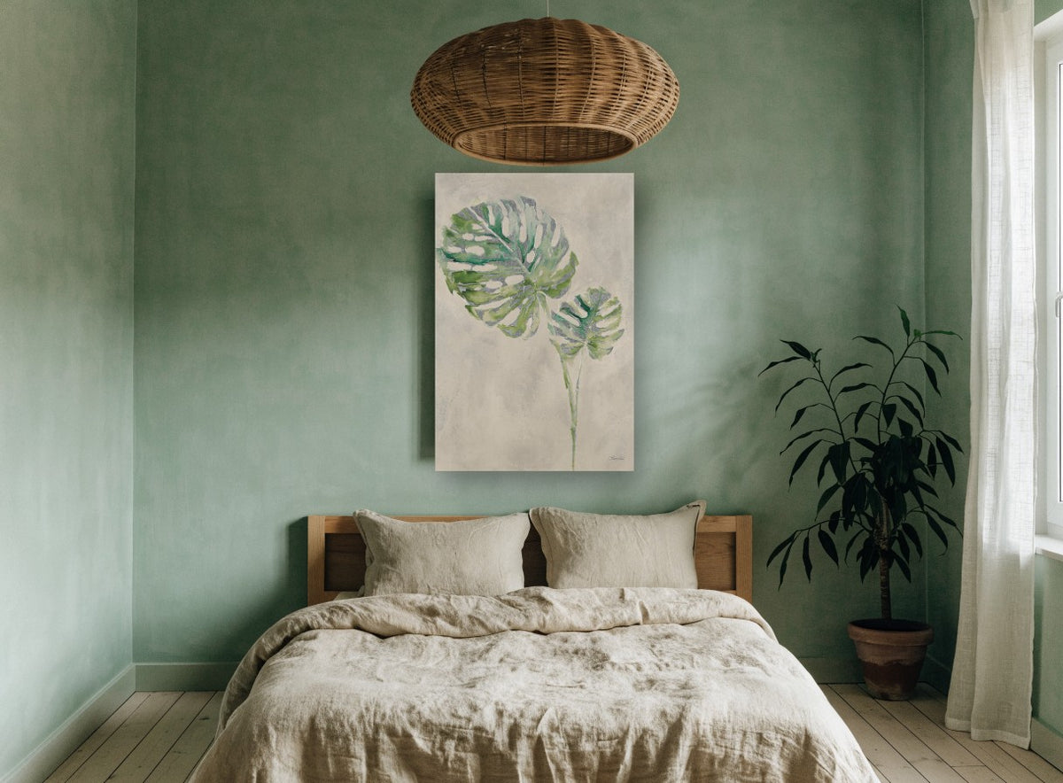 Silver Monstera Pair floral canvas print on the wall of a bedroom