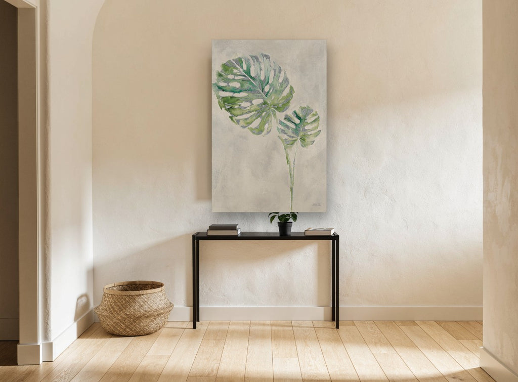 Silver Monstera Pair floral canvas print on the wall of a hallway