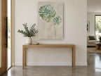 Silver Monstera Pair floral canvas print on the wall of a entry hall