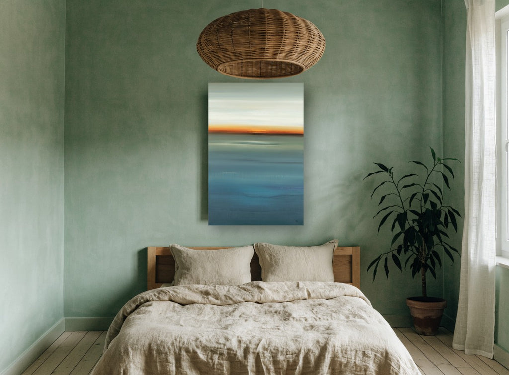 Blue Horizon Glow coastal canvas print on the wall of a bedroom