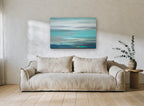 Turquoise Tide Haze coastal canvas print on the wall of a living room