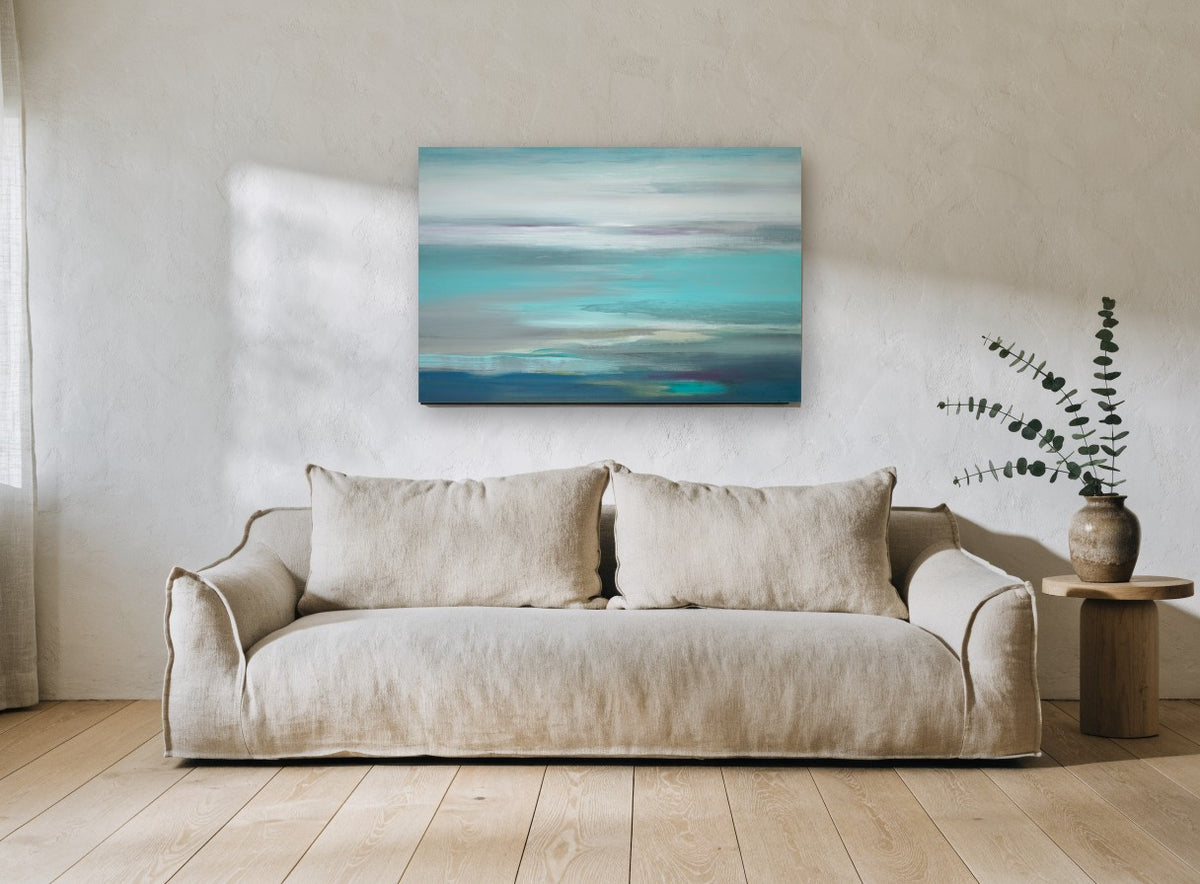 Turquoise Tide Haze coastal canvas print on the wall of a living room