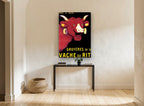 Laughing Red Cow vintage canvas print on the wall of a hallway
