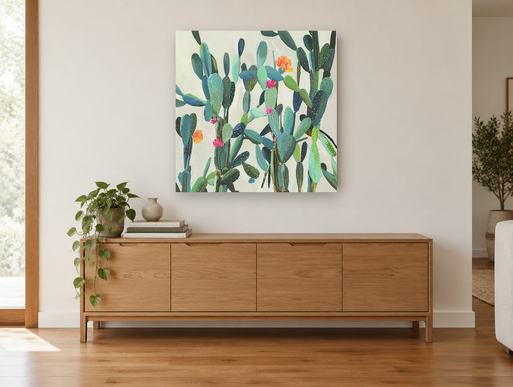Flowering Cactus Garden floral canvas print on the wall of a living room above a sideboard
