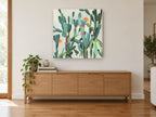 Flowering Cactus Garden floral canvas print on the wall of a living room above a sideboard