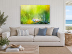 Daisies in Green Meadow floral canvas print on the wall of a beach house living room
