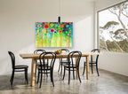Meadow Pom Poms floral canvas print on the wall of a dining room