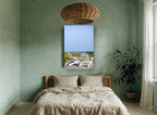 Two White Deck Chairs coastal canvas print on the wall of a bedroom