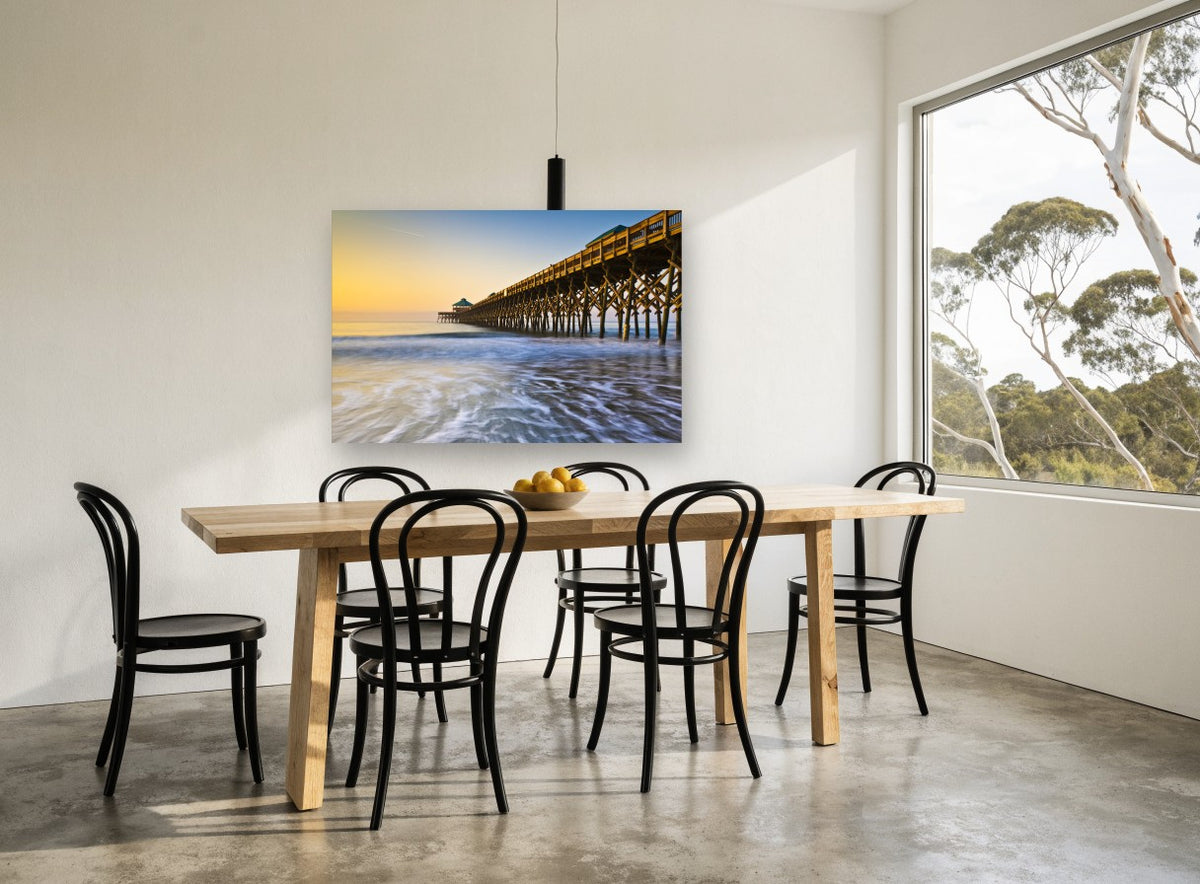 Folly Beach Dawn Pier coastal canvas print on the wall of a dining room