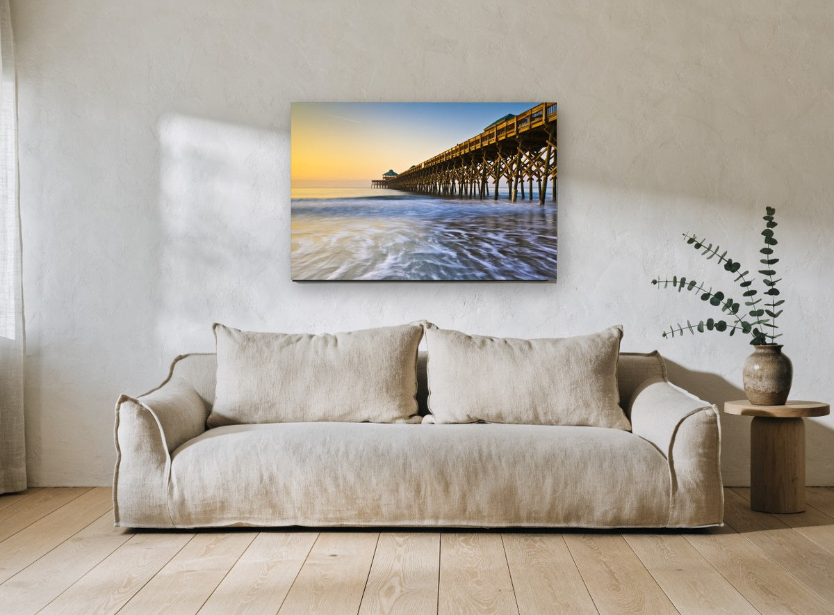 Folly Beach Dawn Pier coastal canvas print on the wall of a living room