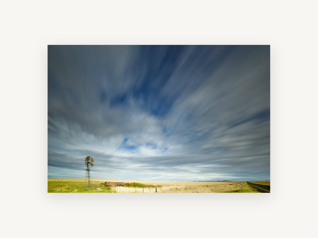 Windmill Under Streaking Sky, windmill long exposure sky photograph, landscape canvas wall art print, front view