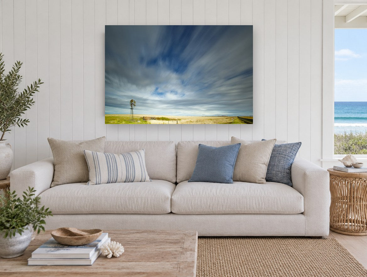Windmill Under Streaking Sky landscape canvas print on the wall of a beach house living room