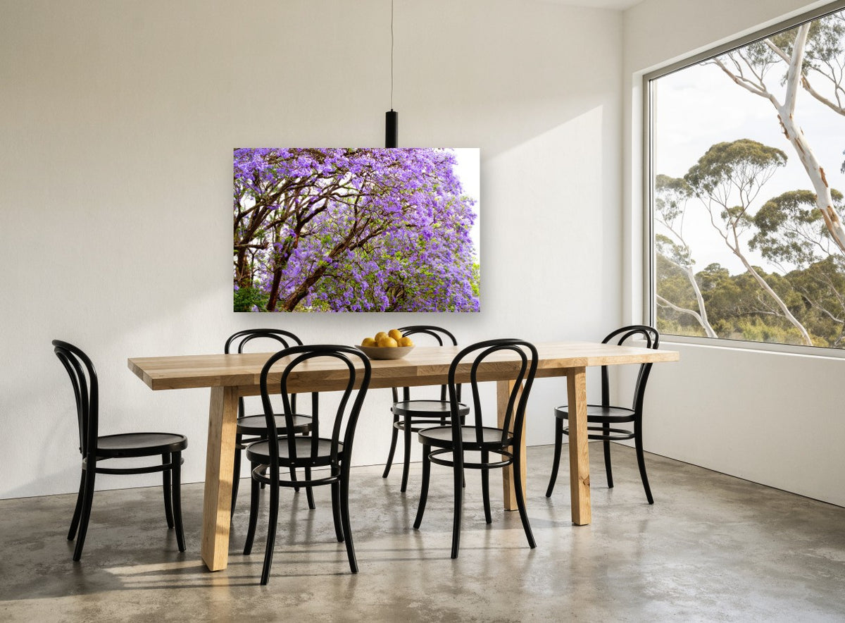 Jacaranda Canopy Bloom floral canvas print on the wall of a dining room