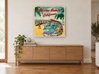 Pismo Beach Surf Bus vintage canvas print on the wall of a living room above a sideboard