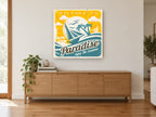 Welcome to Paradise vintage canvas print on the wall of a living room above a sideboard