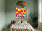Rainbow Gerbera Bloom floral canvas print on the wall of a bedroom