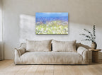 Dandelion Meadow Haze floral canvas print on the wall of a living room
