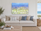 Dandelion Meadow Haze floral canvas print on the wall of a beach house living room
