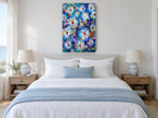 Blue Starburst Blooms floral canvas print on the wall of a coastal bedroom