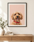 Personalised dog portrait print on a blush pink background in a black frame above a console