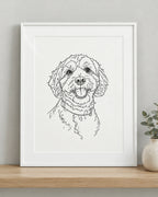 Line art pet portrait print of a cavoodle on paper in a white frame
